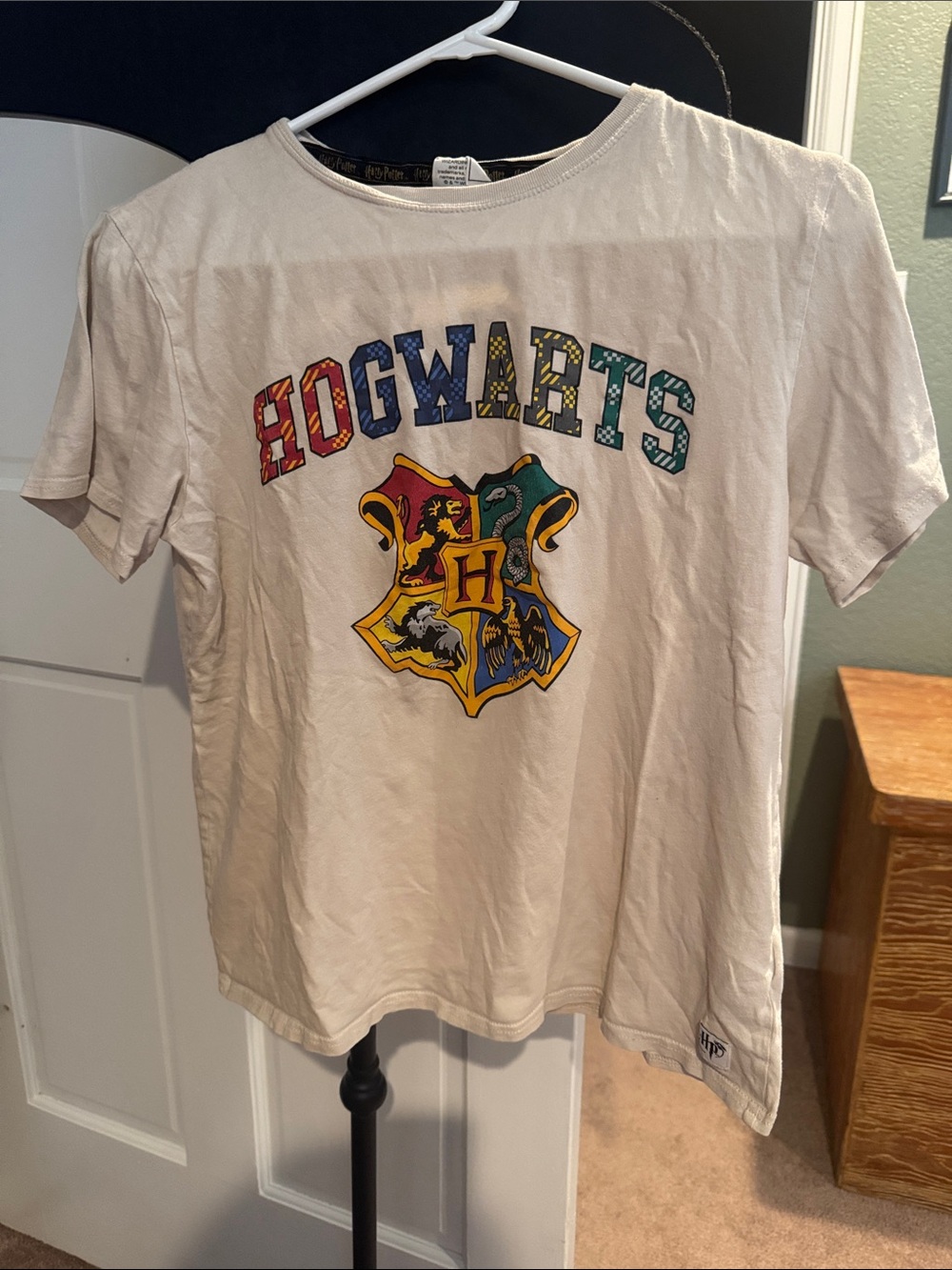 Warner Bros. Hogwarts Crest Tee in White with Multicolor Lettering